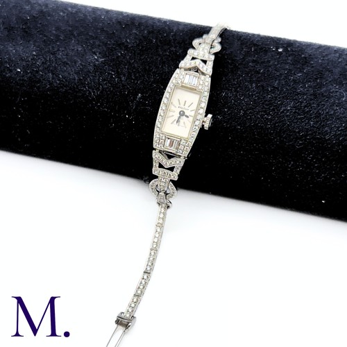 58 - A Vintage Diamond Cocktail Watch

The 18ct white gold cocktail watch is set with approximately 3.0ct... 