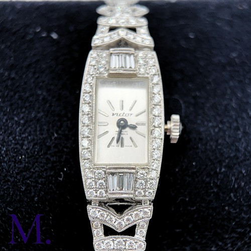 58 - A Vintage Diamond Cocktail Watch

The 18ct white gold cocktail watch is set with approximately 3.0ct... 