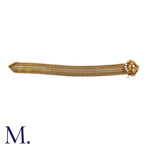 66 - A French Gold and Diamond Buckle Bracelet

The 18ct yellow gold woven bracelet terminates in a diamo... 