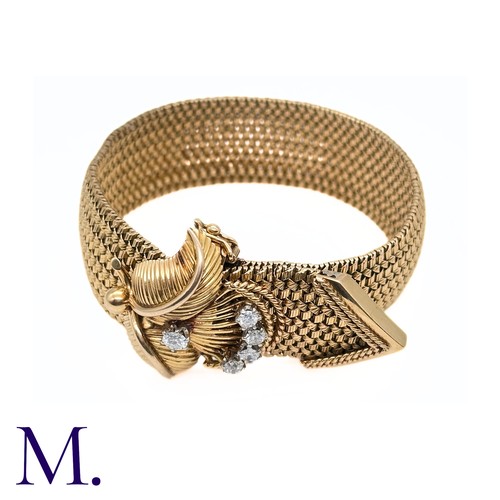 66 - A French Gold and Diamond Buckle Bracelet

The 18ct yellow gold woven bracelet terminates in a diamo... 