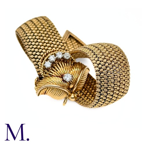 66 - A French Gold and Diamond Buckle Bracelet

The 18ct yellow gold woven bracelet terminates in a diamo... 