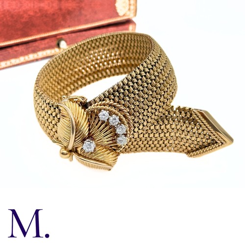 66 - A French Gold and Diamond Buckle Bracelet

The 18ct yellow gold woven bracelet terminates in a diamo... 