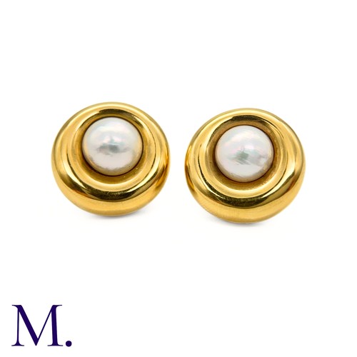 69 - A Pair of Pearl Earclips by Chaumet

The 18ct yellow gold earclips are by Chaumet Paris.  Each is se... 