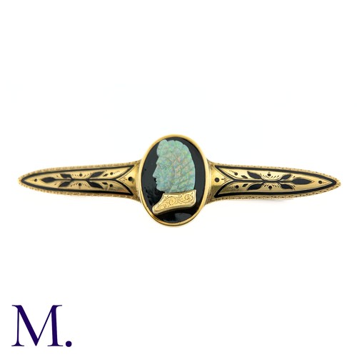 72 - A Carved Opal and Enamel Brooch

The unusual antique gold brooch is set with an impressive carved op... 