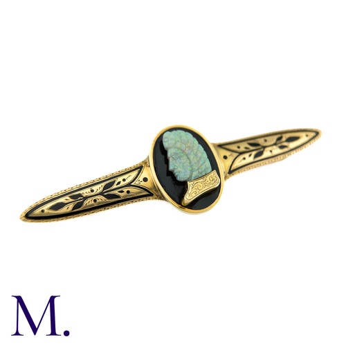 72 - A Carved Opal and Enamel Brooch

The unusual antique gold brooch is set with an impressive carved op... 