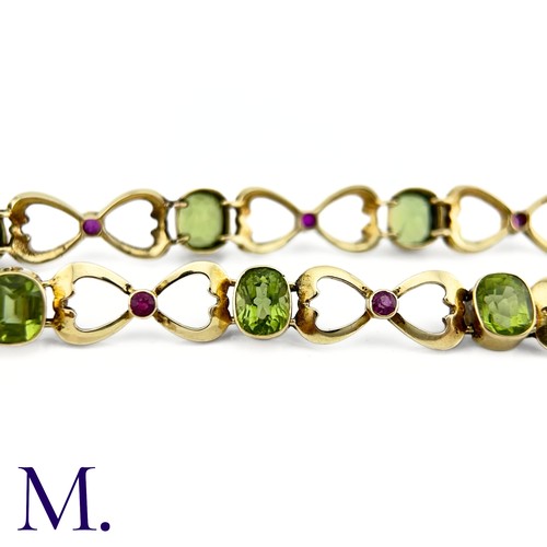 73 - A Suffragette Bracelet

The 15ct gold bracelet is set with peridot and garnet in the suffragette col... 