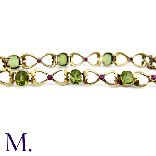 73 - A Suffragette Bracelet

The 15ct gold bracelet is set with peridot and garnet in the suffragette col... 