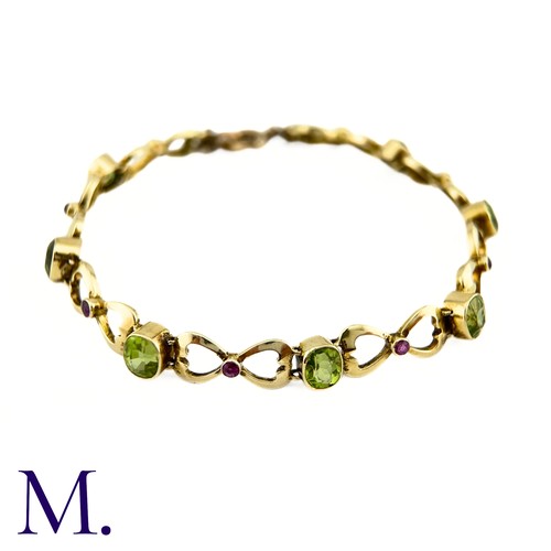 73 - A Suffragette Bracelet

The 15ct gold bracelet is set with peridot and garnet in the suffragette col... 