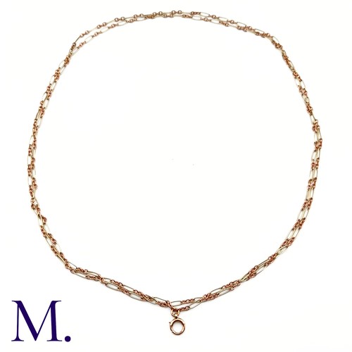 74 - An Antique Rose and White Gold Long Guard Chain

The unusual 9ct rose and white gold long guard chai... 