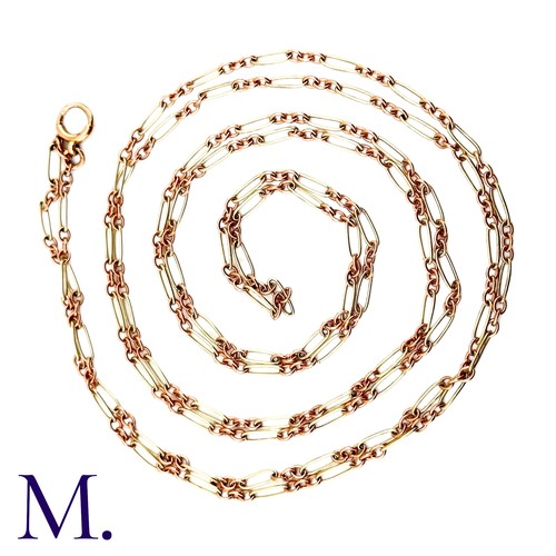 74 - An Antique Rose and White Gold Long Guard Chain

The unusual 9ct rose and white gold long guard chai... 