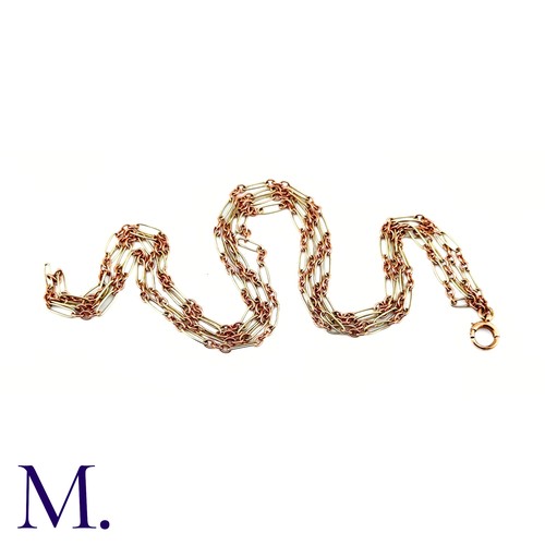 74 - An Antique Rose and White Gold Long Guard Chain

The unusual 9ct rose and white gold long guard chai... 