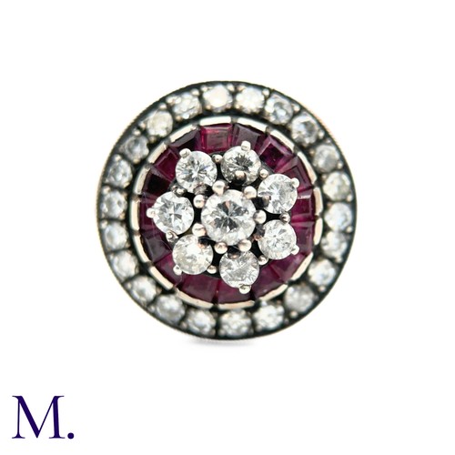 76 - An Antique Ruby and Diamond Cluster Ring.

The antique ruby and diamond ring is set with a cluster o... 