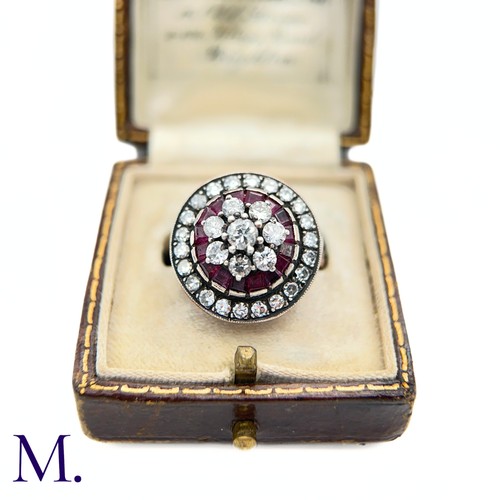 76 - An Antique Ruby and Diamond Cluster Ring.

The antique ruby and diamond ring is set with a cluster o... 