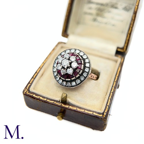 76 - An Antique Ruby and Diamond Cluster Ring.

The antique ruby and diamond ring is set with a cluster o... 