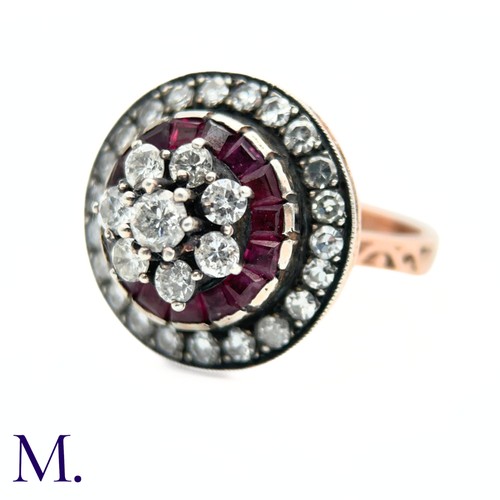 76 - An Antique Ruby and Diamond Cluster Ring.

The antique ruby and diamond ring is set with a cluster o... 