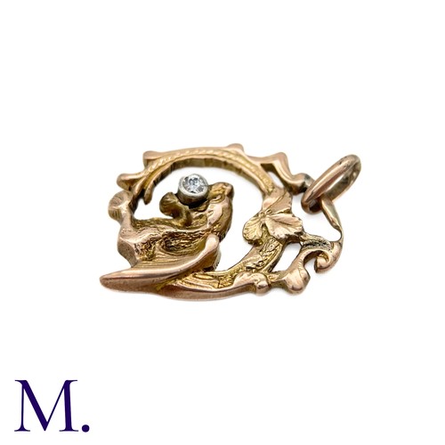 77 - An Art Nouveau Chimera Pendant

The antique gold chimera pendant is set with a small 5pt old cut dia... 