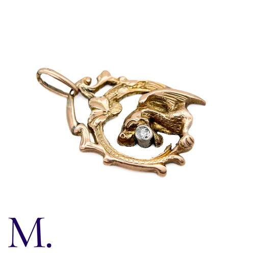 77 - An Art Nouveau Chimera Pendant

The antique gold chimera pendant is set with a small 5pt old cut dia... 