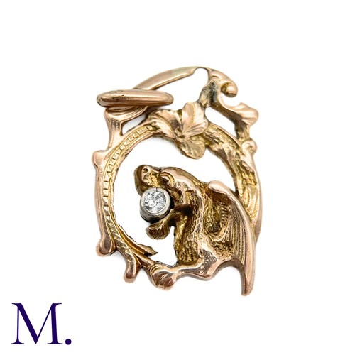 77 - An Art Nouveau Chimera Pendant

The antique gold chimera pendant is set with a small 5pt old cut dia... 