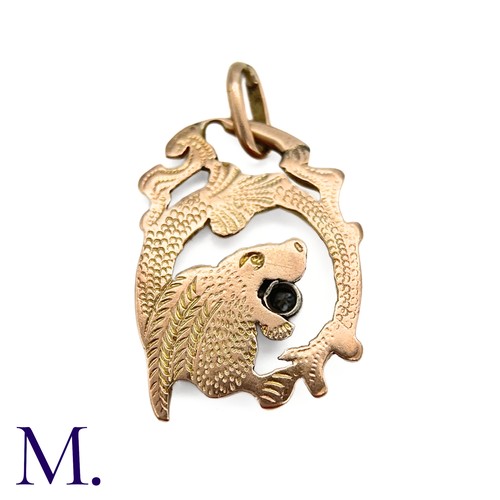 77 - An Art Nouveau Chimera Pendant

The antique gold chimera pendant is set with a small 5pt old cut dia... 