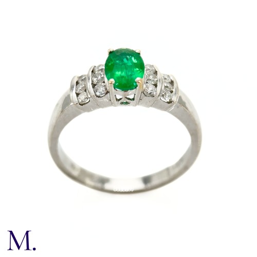 44 - An Emerald and Diamond Ring

The 18ct white gold ring is set with an oval-cut emerald of approximate... 