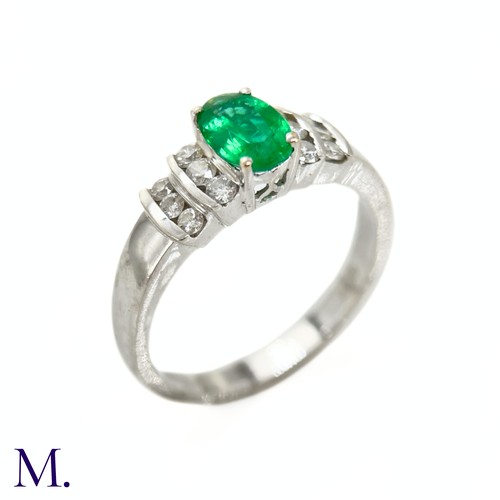 44 - An Emerald and Diamond Ring

The 18ct white gold ring is set with an oval-cut emerald of approximate... 