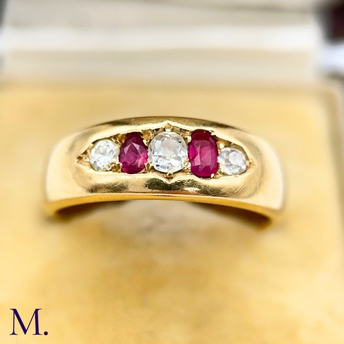 83 - A Ruby and Diamond Gypsy Ring

The 18ct yellow gold band is set with two bright rubies and three old... 