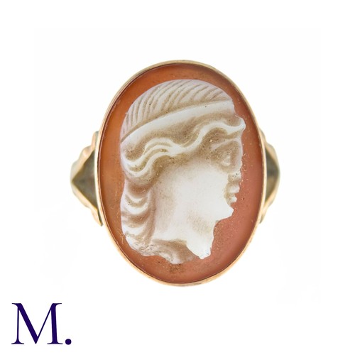 22 - A Carved Carnelian Cameo Ring in 9k yellow gold, the carnelian cameo depicting a woman in profile. H... 