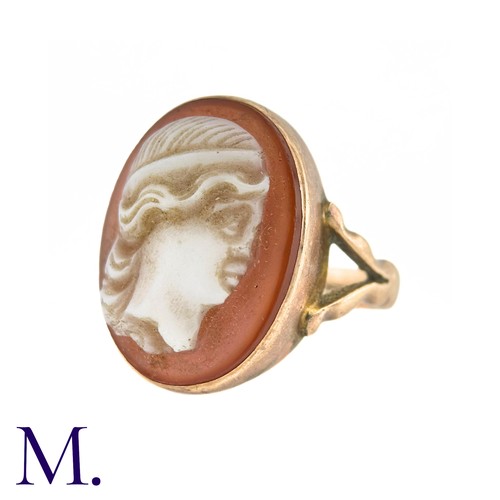 22 - A Carved Carnelian Cameo Ring in 9k yellow gold, the carnelian cameo depicting a woman in profile. H... 