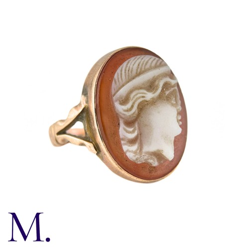 22 - A Carved Carnelian Cameo Ring in 9k yellow gold, the carnelian cameo depicting a woman in profile. H... 