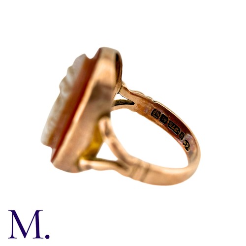 22 - A Carved Carnelian Cameo Ring in 9k yellow gold, the carnelian cameo depicting a woman in profile. H... 