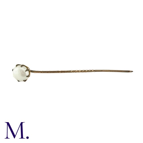 85 - An Antique Pearl Stick Pin, in yellow metal, the terminal set with a pearl of approximately 9mm. 

S... 