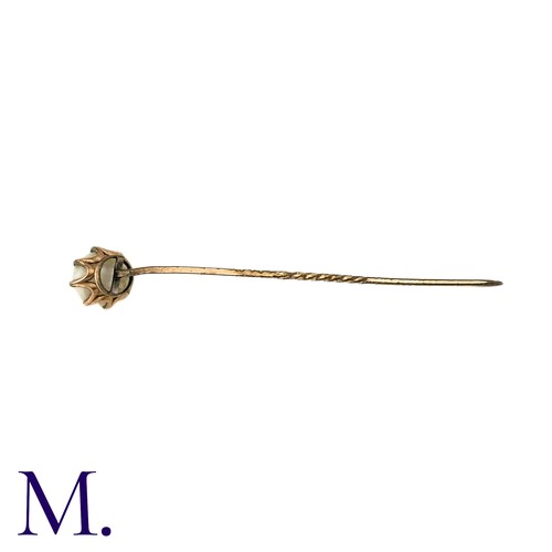 85 - An Antique Pearl Stick Pin, in yellow metal, the terminal set with a pearl of approximately 9mm. 

S... 