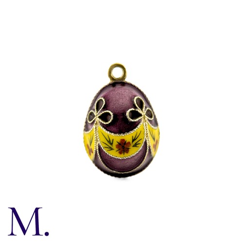 86 - An Enamelled Egg Pendant with purple, yellow, orange and green enamel. 

Size: 2.1cm
Weight: 6.2cm.