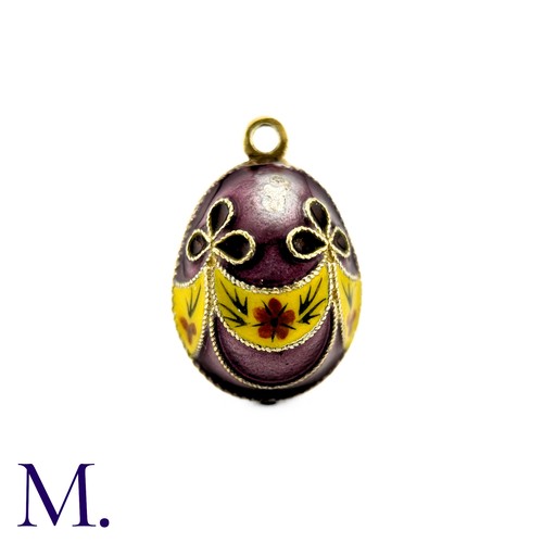 86 - An Enamelled Egg Pendant with purple, yellow, orange and green enamel. 

Size: 2.1cm
Weight: 6.2cm.