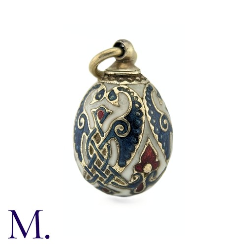 68 - An Enamelled Egg Pendant with blue, red and white enamel. No markings visible. 

Size: 2.2cm
Weight:... 