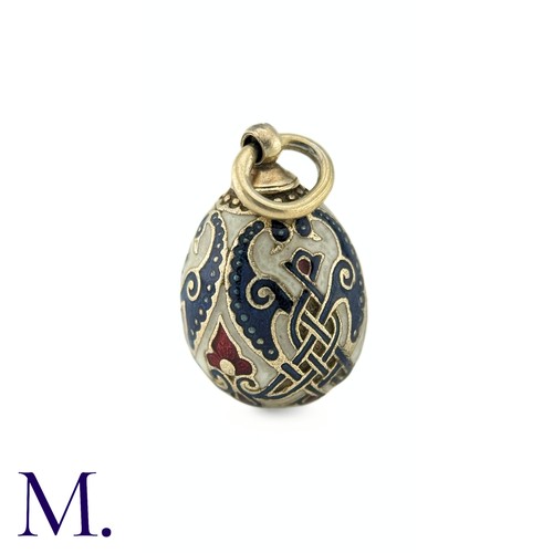 68 - An Enamelled Egg Pendant with blue, red and white enamel. No markings visible. 

Size: 2.2cm
Weight:... 