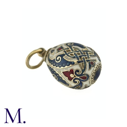 68 - An Enamelled Egg Pendant with blue, red and white enamel. No markings visible. 

Size: 2.2cm
Weight:... 