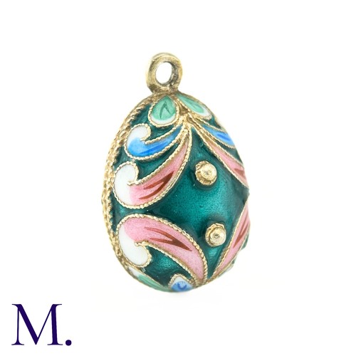 32 - An Enamelled Egg Pendant, with green, pink, blue and white enamel. No marks visible.

Size: 2.1cm
We... 