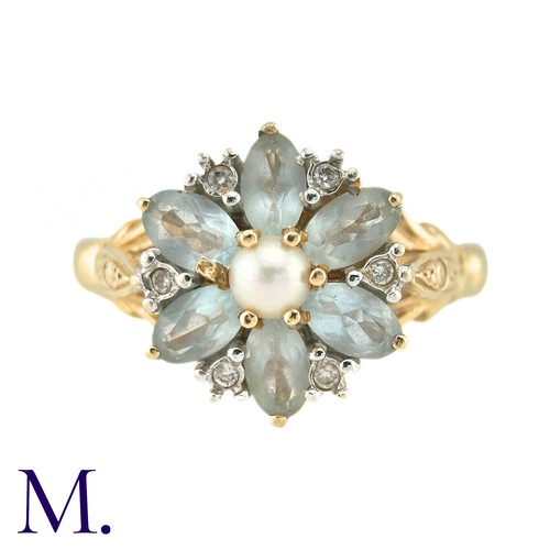 10 - A Pearl, White Sapphire And Aquamarine Dress Ring, in 14k yellow gold, the central pearl surrounded ... 