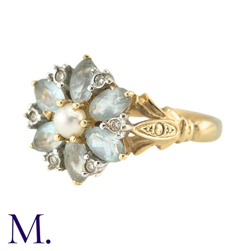 10 - A Pearl, White Sapphire And Aquamarine Dress Ring, in 14k yellow gold, the central pearl surrounded ... 