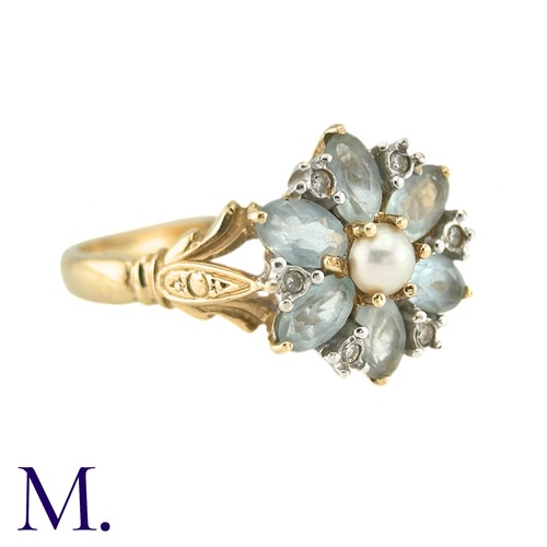 10 - A Pearl, White Sapphire And Aquamarine Dress Ring, in 14k yellow gold, the central pearl surrounded ... 