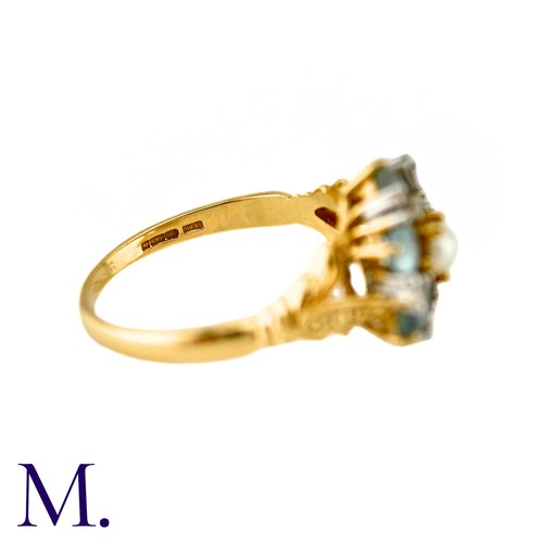 10 - A Pearl, White Sapphire And Aquamarine Dress Ring, in 14k yellow gold, the central pearl surrounded ... 