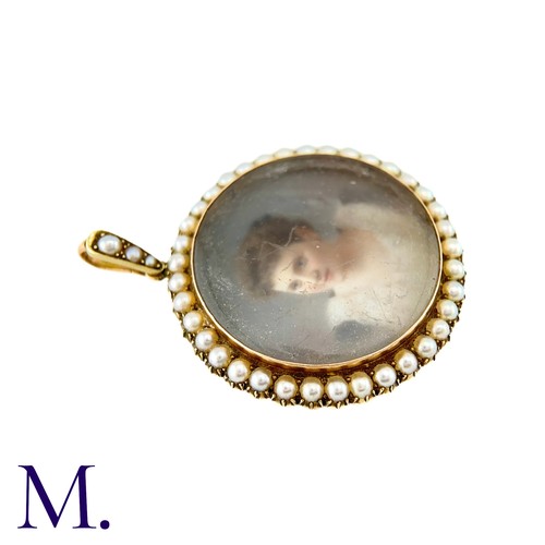 15 - An Antique Portrait Miniature Pendant in yellow gold, set with a miniature depicting a woman, in a b... 