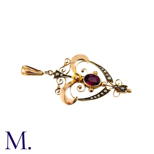 287 - An Antique Garnet and Pearl Pendant in 9k yellow gold, set with a principal oval cut garnet accented... 