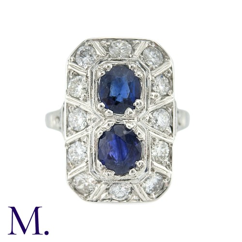 36 - An Art Deco Sapphire And Diamond Ring in 18k white gold, set with two principal cushion cut sapphire... 