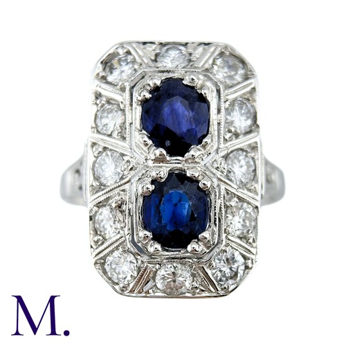 36 - An Art Deco Sapphire And Diamond Ring in 18k white gold, set with two principal cushion cut sapphire... 