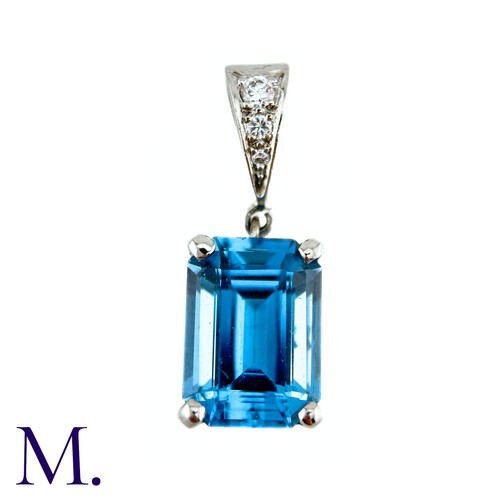 77 - A Blue Topaz And Diamond Pendant in 18k white gold the principal blue topaz of approximately 8.50cts... 