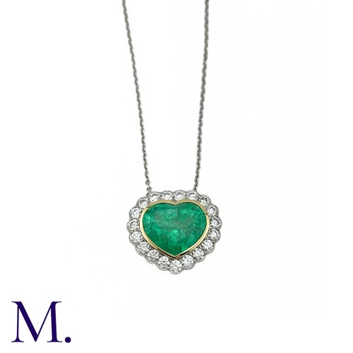 76 - An Emerald And Diamond Heart Shaped Cluster Pendant in 18k yellow gold and platinum, the principal h... 