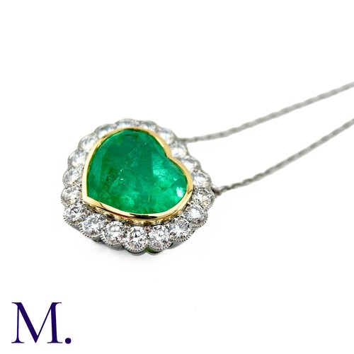 76 - An Emerald And Diamond Heart Shaped Cluster Pendant in 18k yellow gold and platinum, the principal h... 