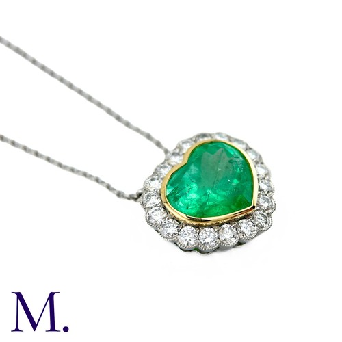 76 - An Emerald And Diamond Heart Shaped Cluster Pendant in 18k yellow gold and platinum, the principal h... 